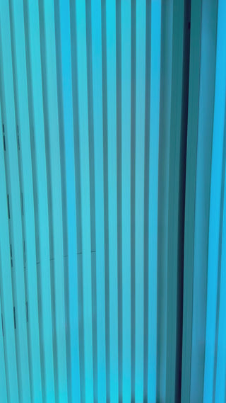 Close-up of the stand-up UV tanning bed (Pink Sands Room) at Beach Gypsy in Berlin, MD