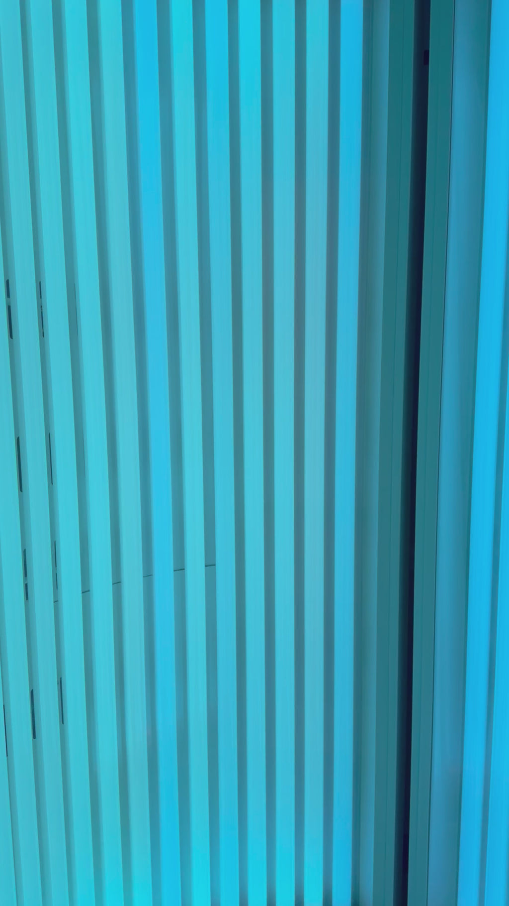 Close-up of the stand-up UV tanning bed (Pink Sands Room) at Beach Gypsy in Berlin, MD