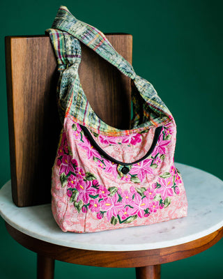 Recycled Guatemalan Huipile Purse shown from the front, highlighting its textured finish and hardware