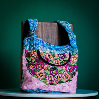 Recycled Guatemalan Huipile Purse shown from the front, highlighting its textured finish and hardware