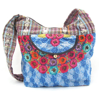 Recycled Guatemalan Huipile Purse shown from the front, highlighting its textured finish and hardware