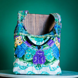 Recycled Guatemalan Huipile Purse shown from the front, highlighting its textured finish and hardware