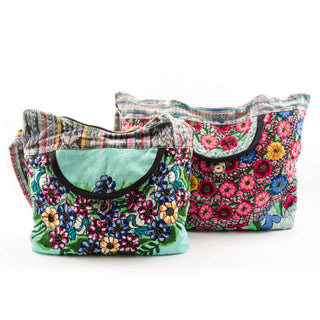 Recycled Guatemalan Huipile Purse shown from the front, highlighting its textured finish and hardware