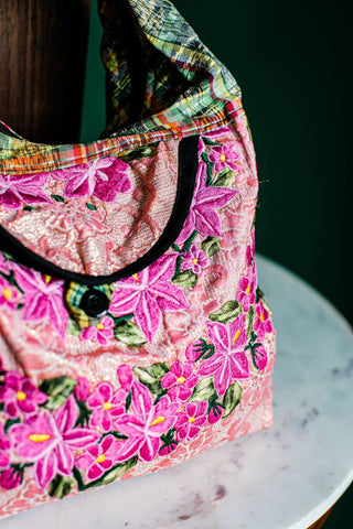 Recycled Guatemalan Huipile Purse shown from the front, highlighting its textured finish and hardware