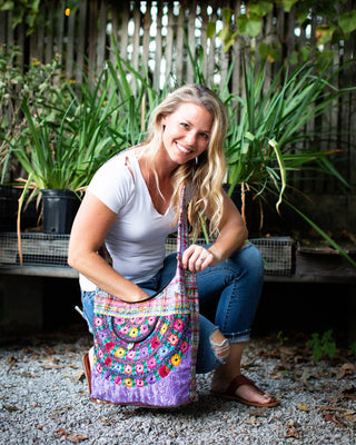 Recycled Guatemalan Huipile Purse shown from the front, highlighting its textured finish and hardware