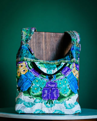 Recycled Guatemalan Huipile Purse shown from the front, highlighting its textured finish and hardware