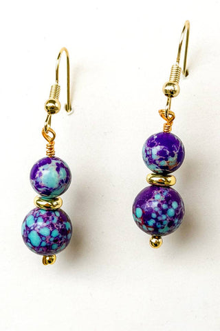 Close-up of Ruthie Blue & Purple Jasper Dangle Earrings dangle earrings laid flat, showing their blue detail