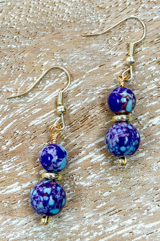 Close-up of Ruthie Blue & Purple Jasper Dangle Earrings dangle earrings laid flat, showing their blue detail
