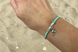 Seahorse Bracelet laid flat, showing its coastal-inspired charm and clasp
