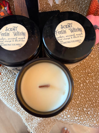 Seasonal Wood Wick Soy Candles in a glass jar with a visible wood wick, styled with seasonal decor