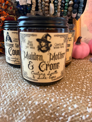 Seasonal Wood Wick Soy Candles in a glass jar with a visible wood wick, styled with seasonal decor