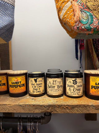 Seasonal Wood Wick Soy Candles in a glass jar with a visible wood wick, styled with seasonal decor