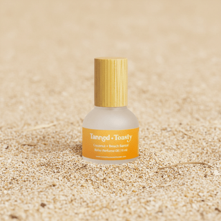 Tanned + Toasty Perfume Rollerball bottle displayed upright, showing its label and cap design