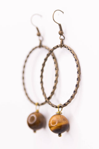 Close-up of Tiger's Eye Earrings dangle earrings laid flat, showing their tiger's eye detail