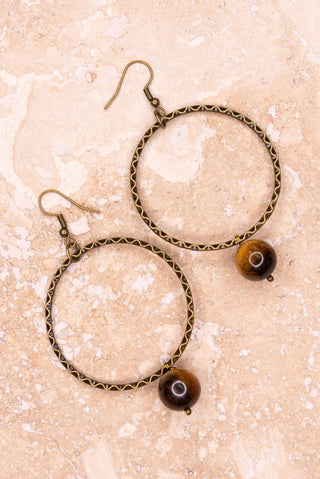 Close-up of Tiger's Eye Earrings dangle earrings laid flat, showing their tiger's eye detail